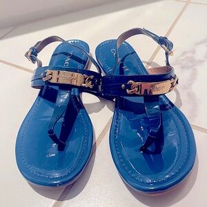 Woman’s Blue Coach sandals with gold